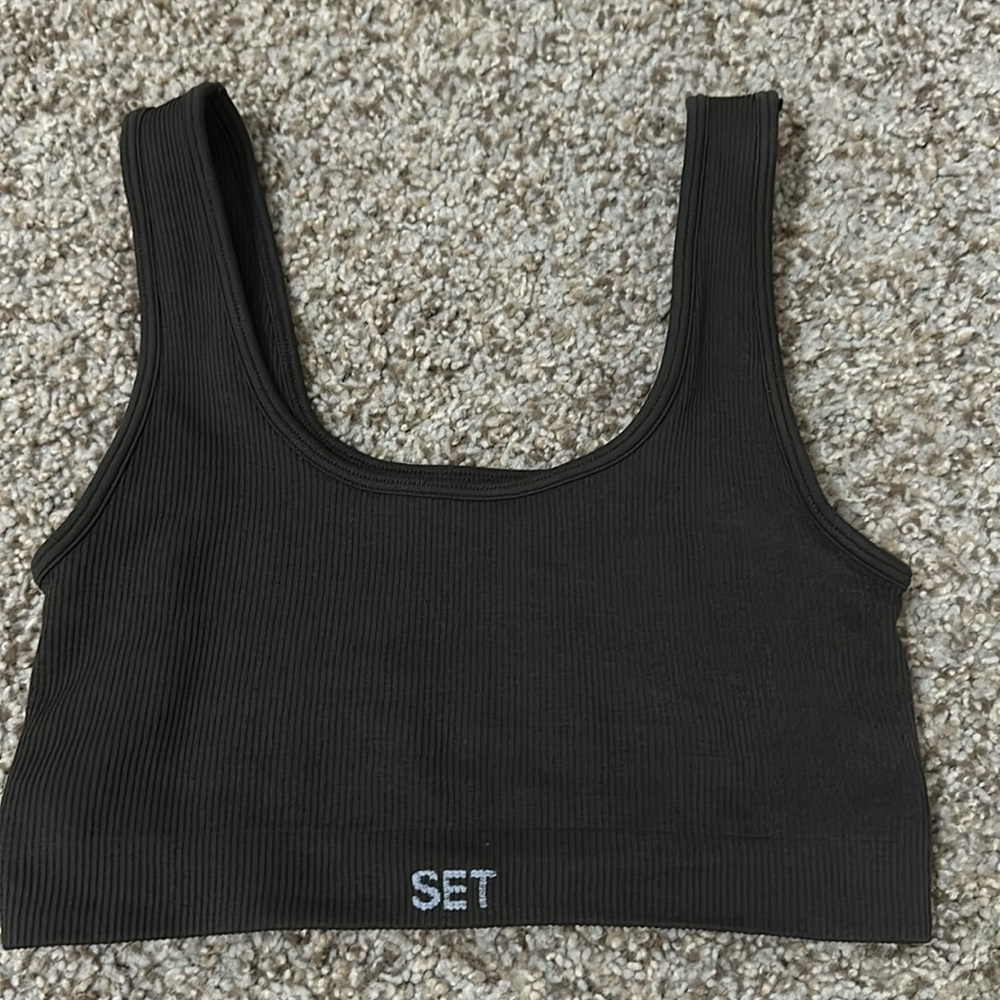 Set active wear top size xs. Brand new . Dark brown color